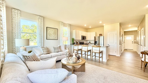 The kitchen is open to the ample living room and dining area making family gatherings effortless.