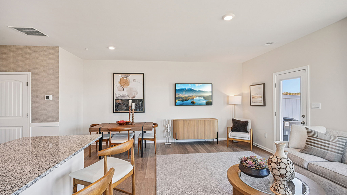 The kitchen is open to the ample living room and dining area making family gatherings effortless.
