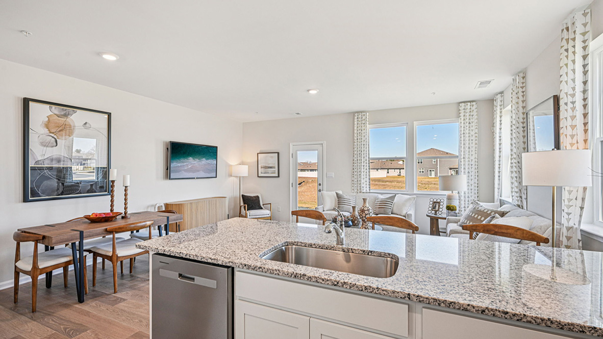 The home's functional eat-in kitchen features granite countertops.