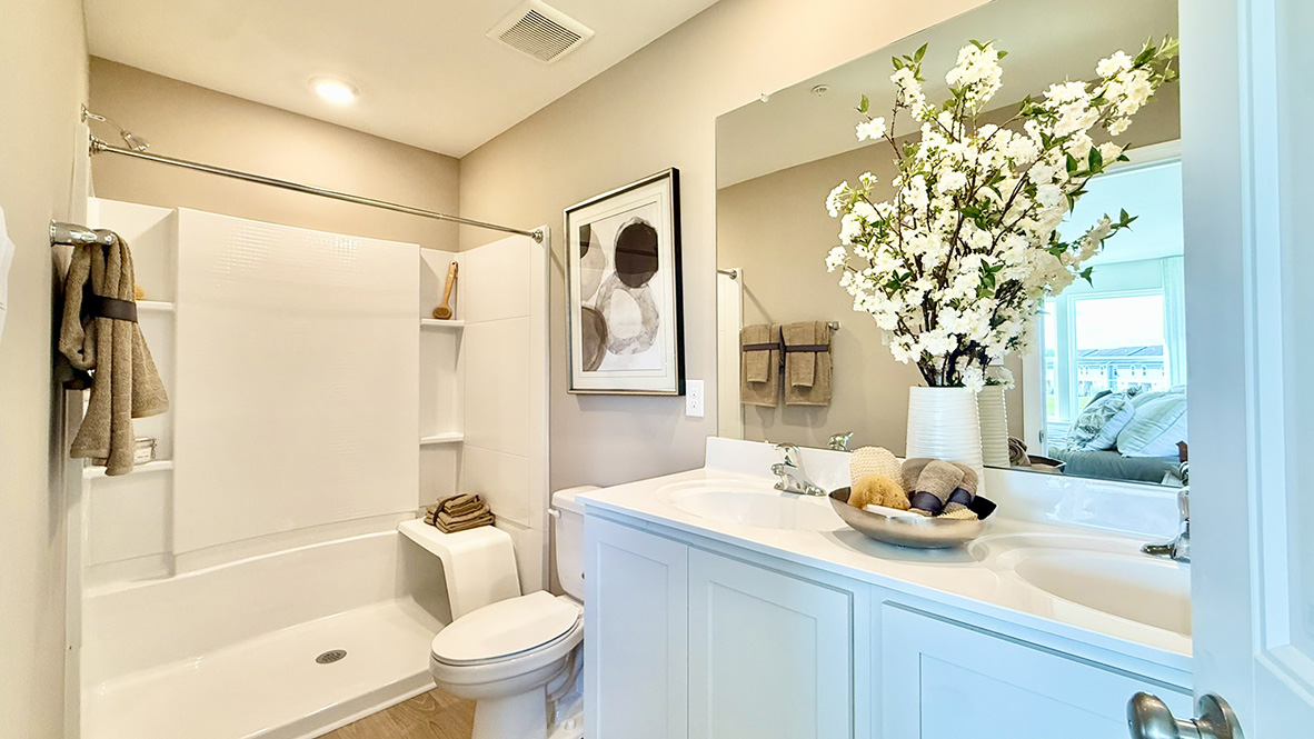 Upstairs, the spacious main bedroom comes complete with a modern bathroom with a double bowl vanity, and generously sized walk-in shower.