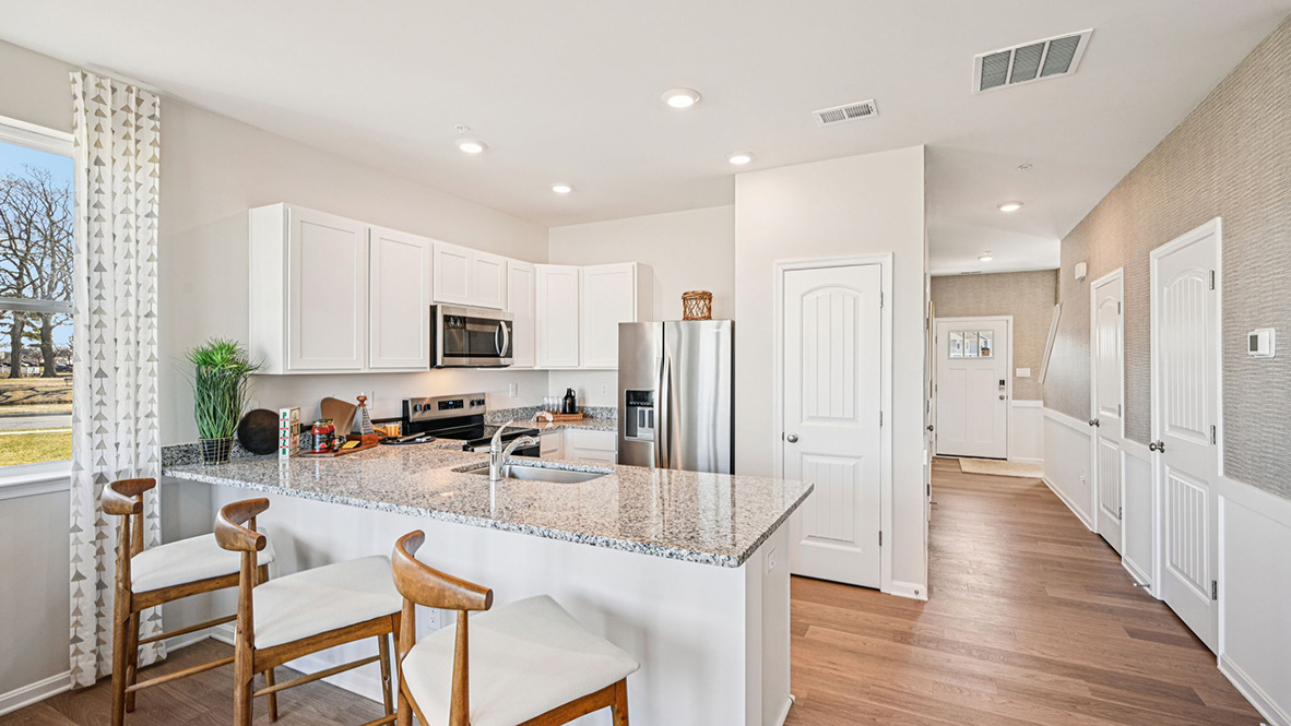 The home's functional eat-in kitchen features ample cabinet space.