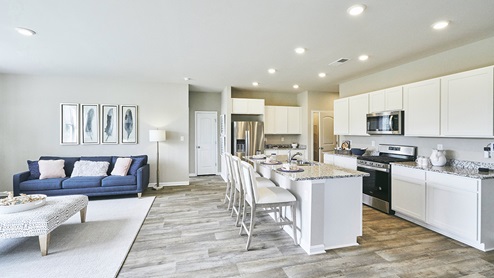 The home's well-designed kitchen features an oversized island with room for seating.