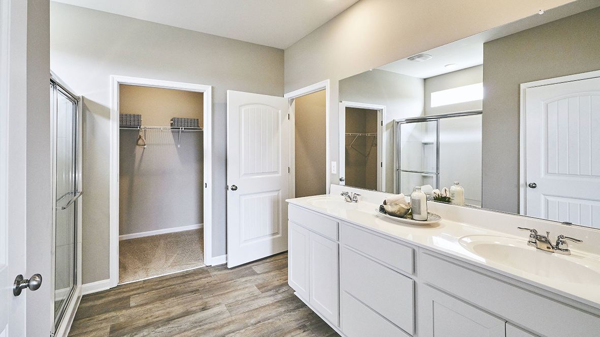 The private bathroom has a double-bowl vanity.