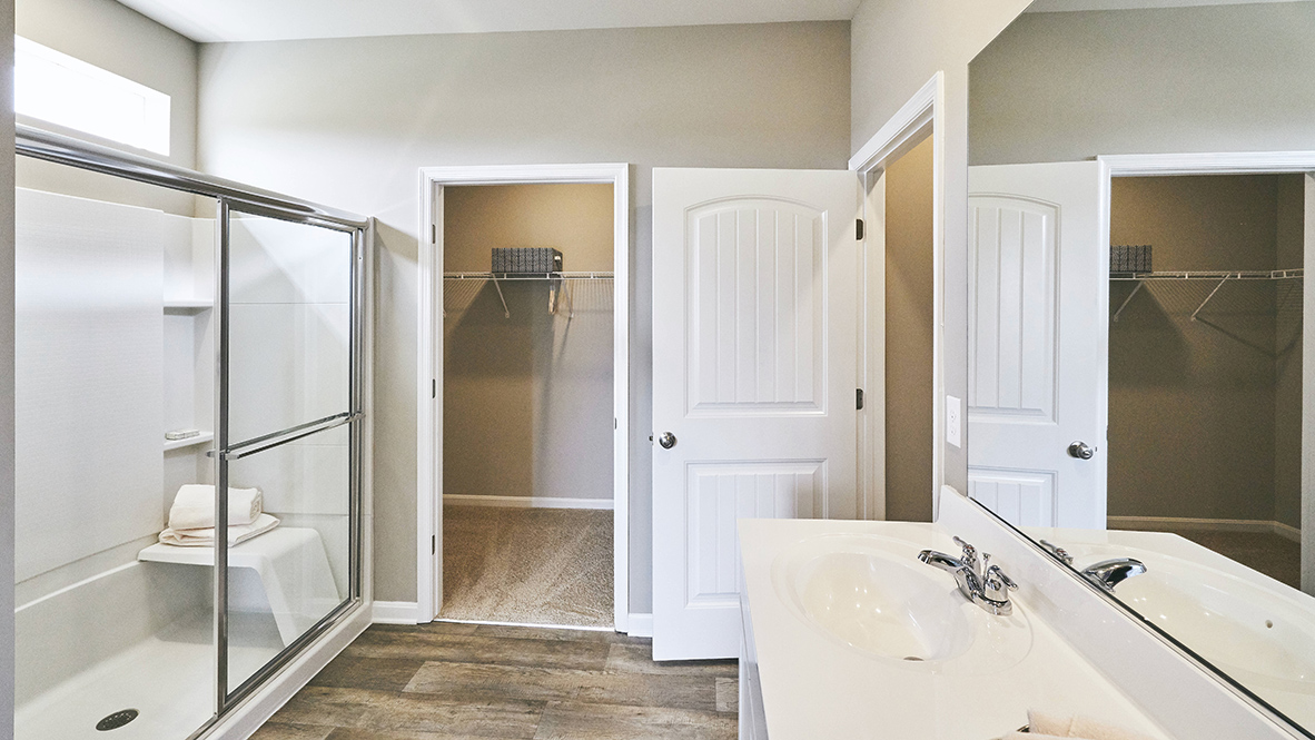 The private bathroom has a walk-in shower.