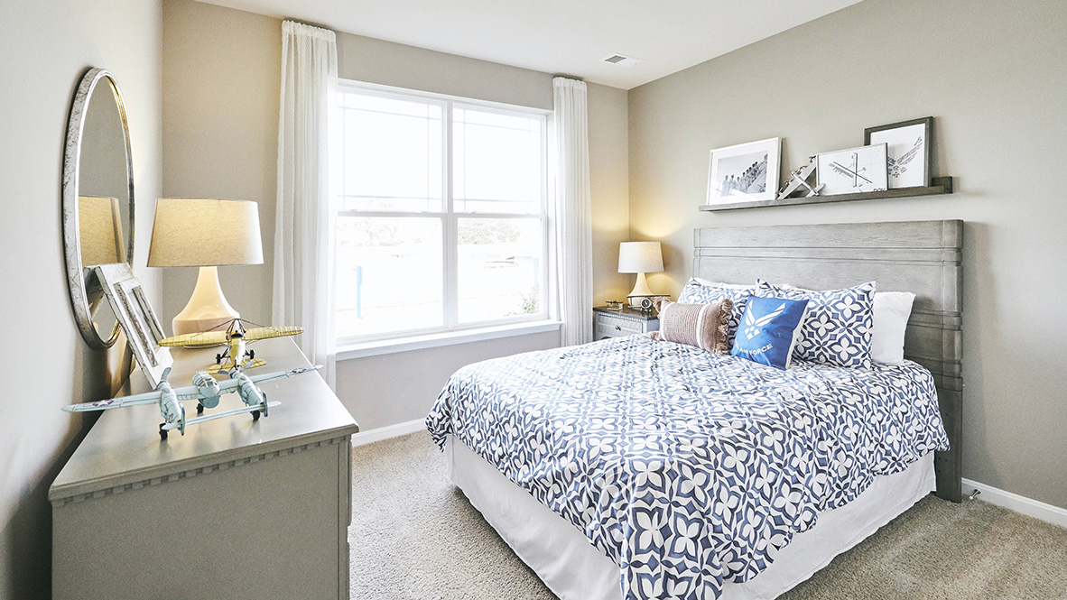 Two guest bedrooms are at the entrance of the home.