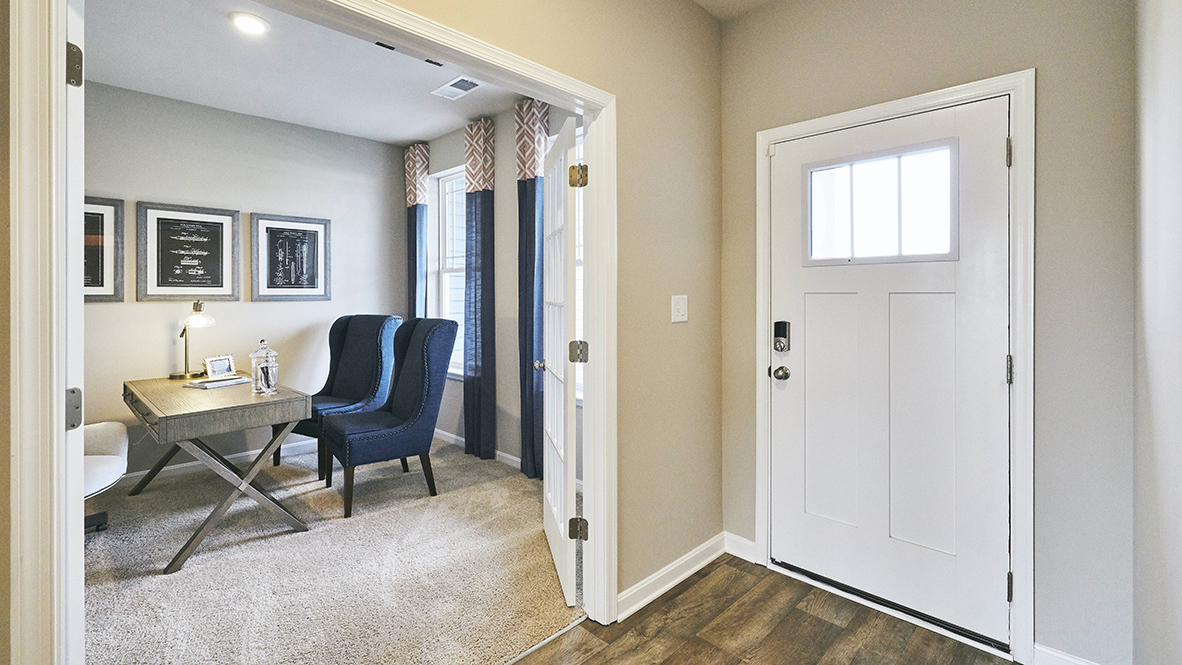 A welcoming foyer leads you to the inviting flex room with an abundance of natural light.