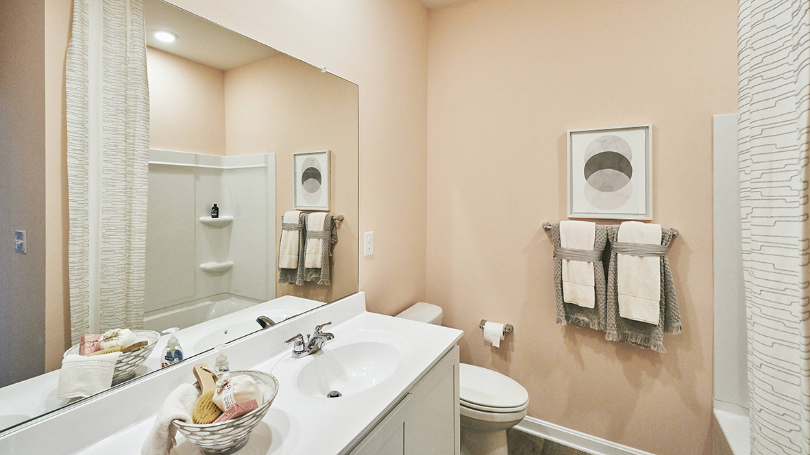 A shared guest bathroom is at the front of the home.