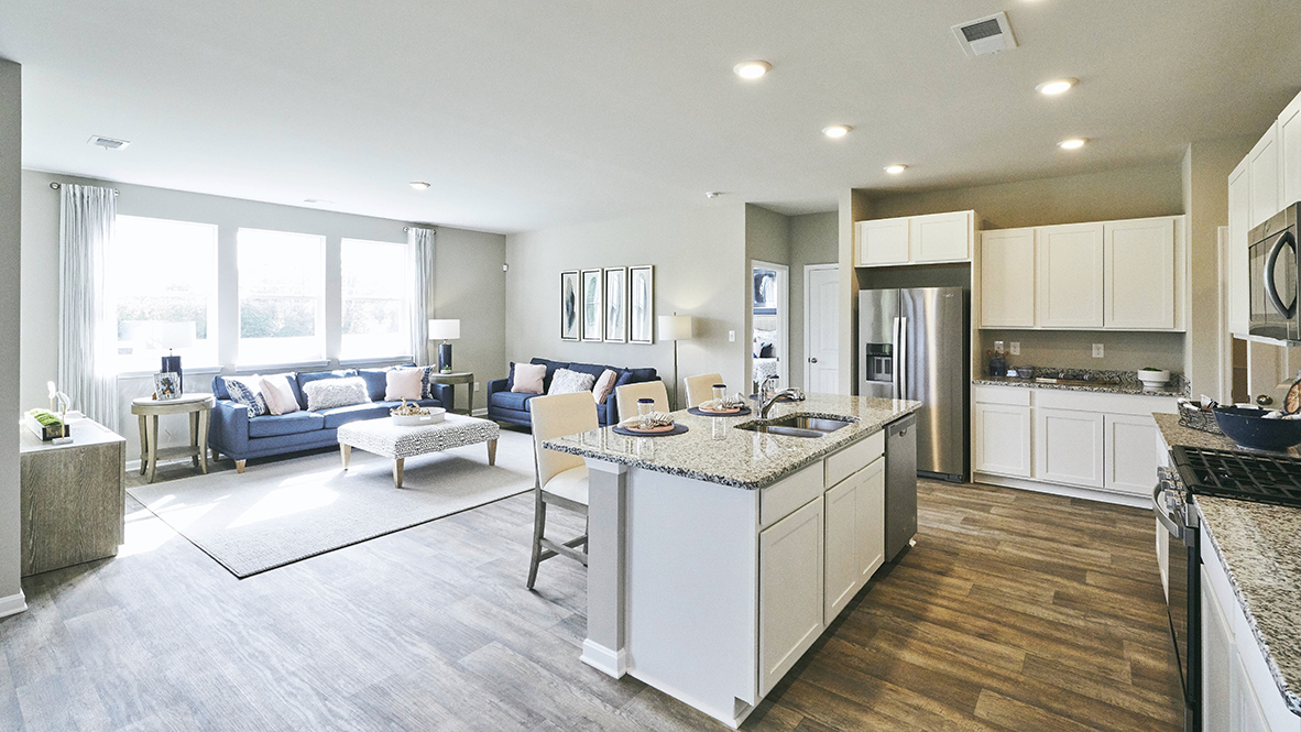 The home's well-designed kitchen features stylish soft close cabinets.
