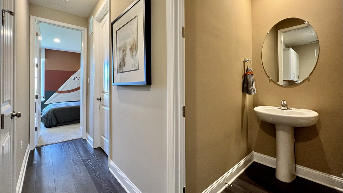 On the other side of the hallway is a powder room.