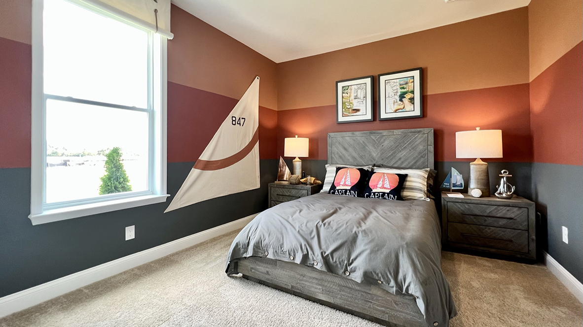 Another guest bedroom has lots of natural light.