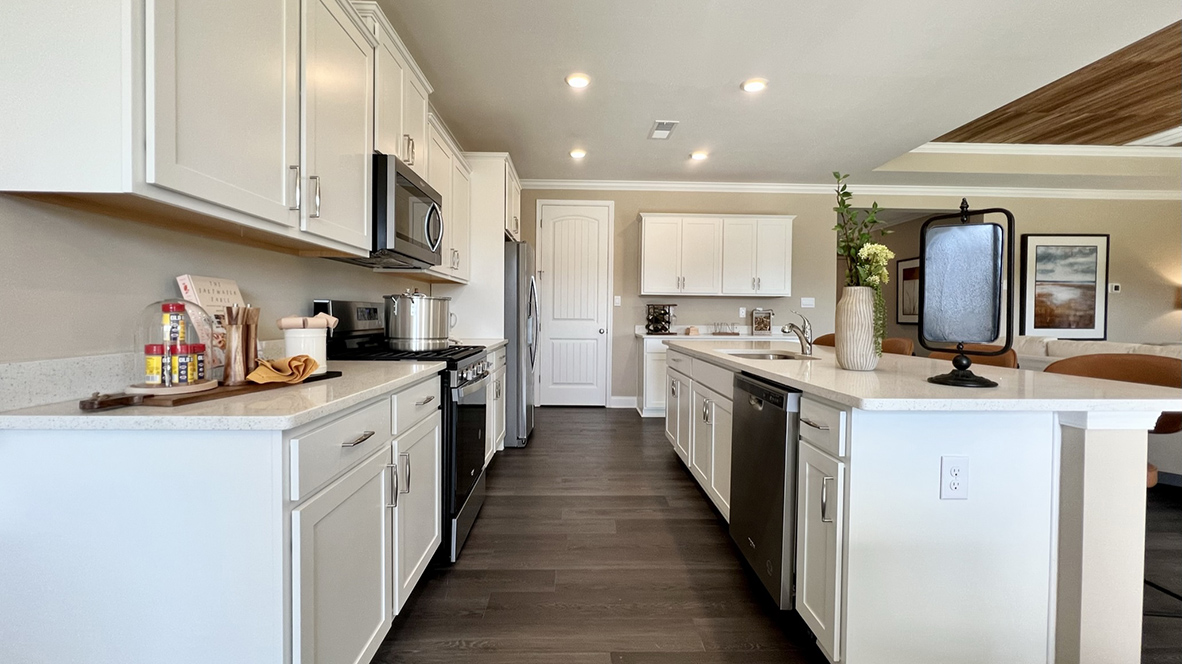 The kitchen is complete with classic cabinets.