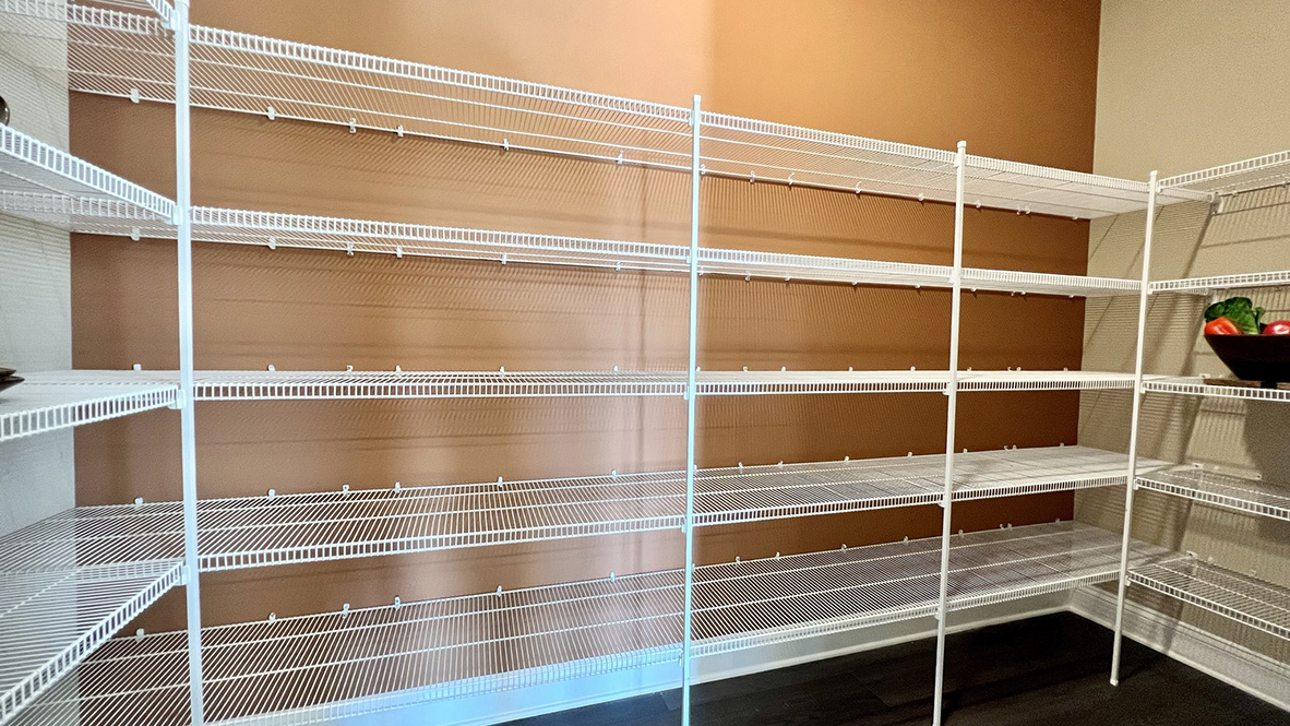 The corner walk-in pantry is expansive.