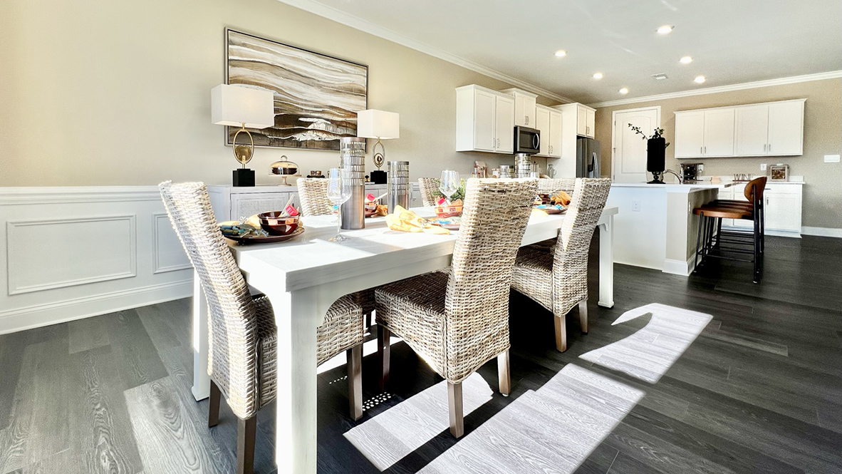 The kitchen overlooks the large dining room.
