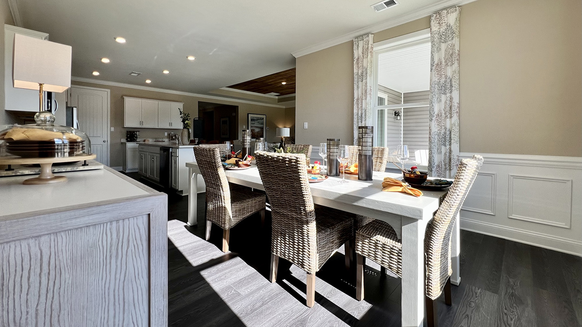 The kitchen overlooks the large dining room.