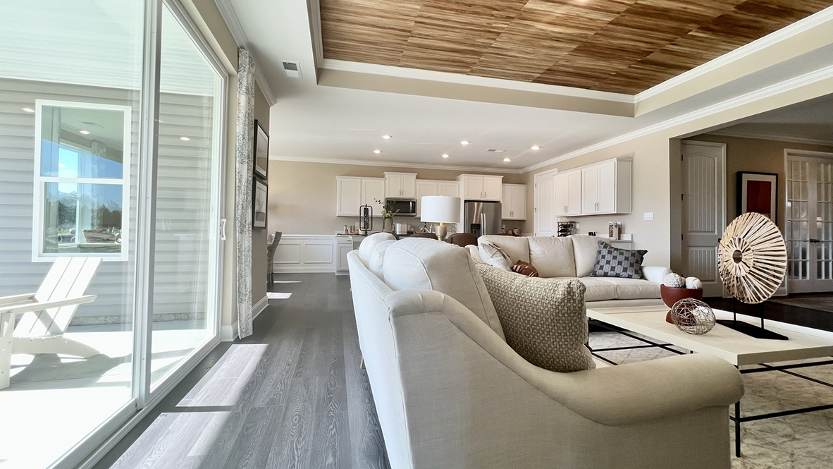 The door to the covered porch allows light to brighten the great room.