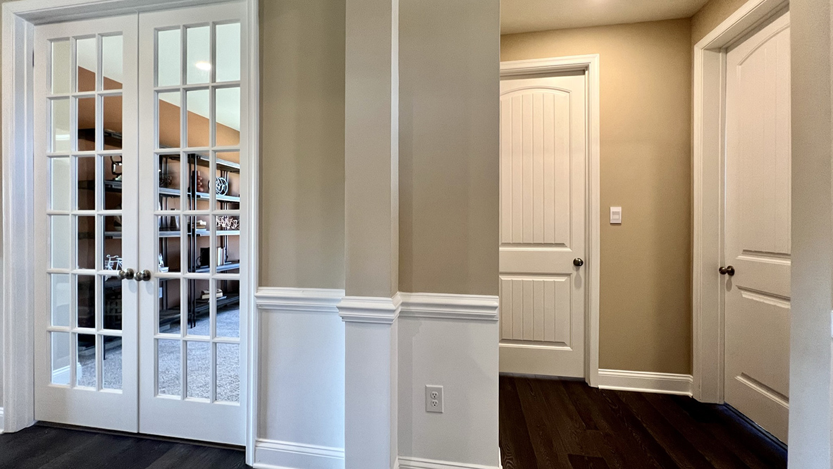 A welcoming foyer leads you to a guest bedroom and the study.