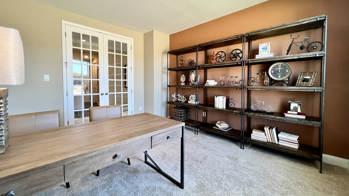 The study has beautiful French doors.