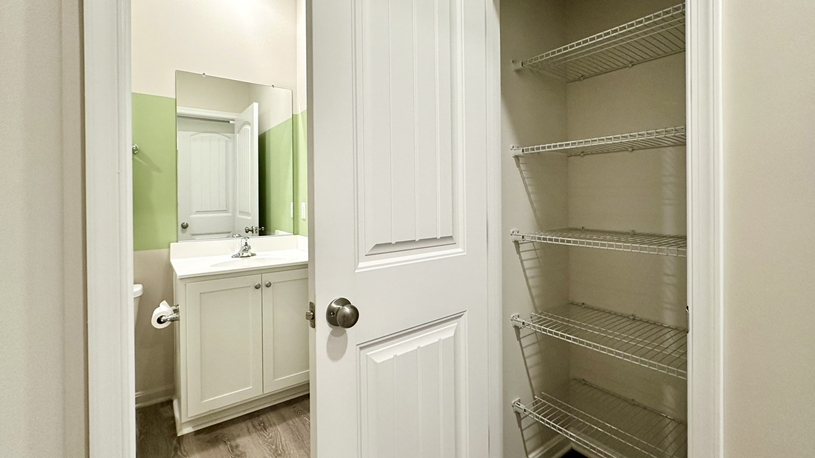 The guest bathroom and linen closet is across the hall from guest bedroom.