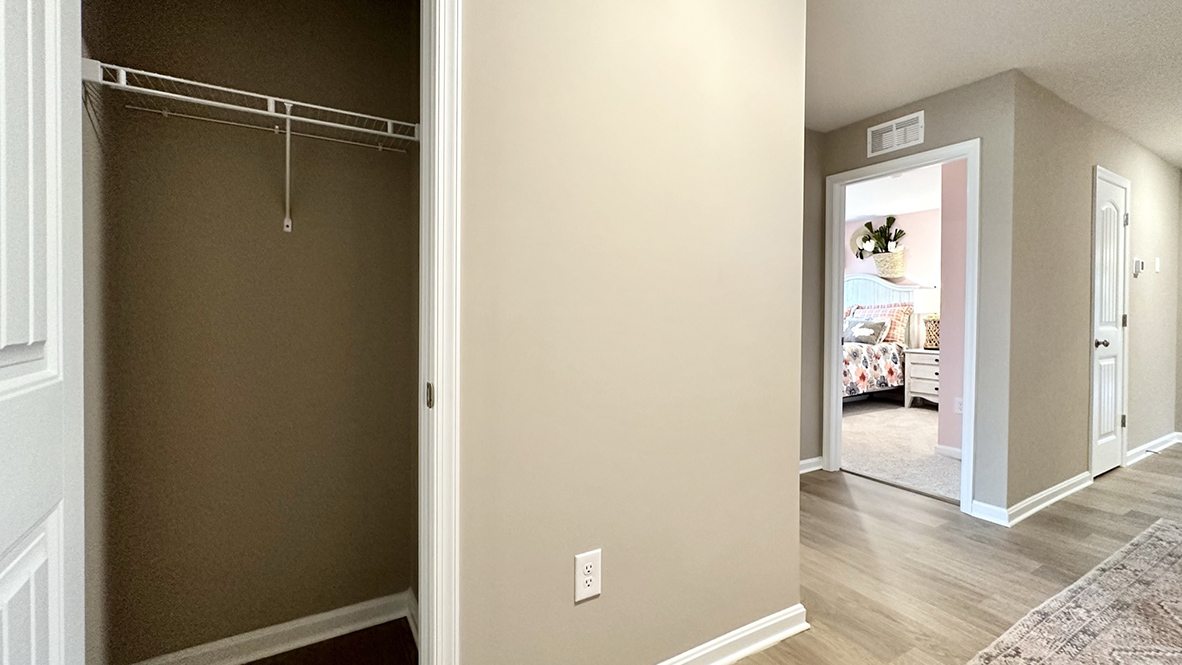 A coat closet greets you in the entrance way.