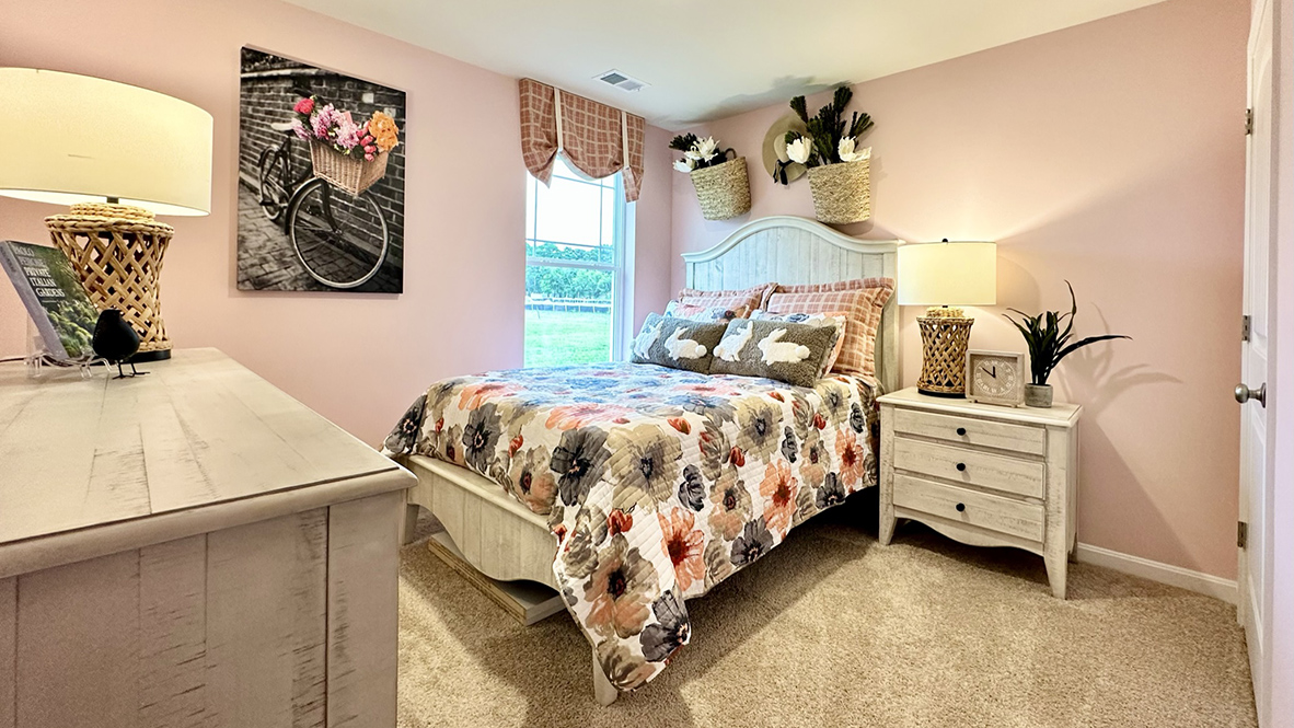 The guest bedroom has a window in the corner.