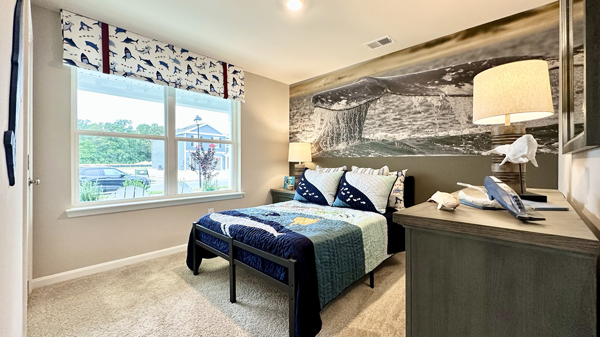 The second guest bedroom has a double window.