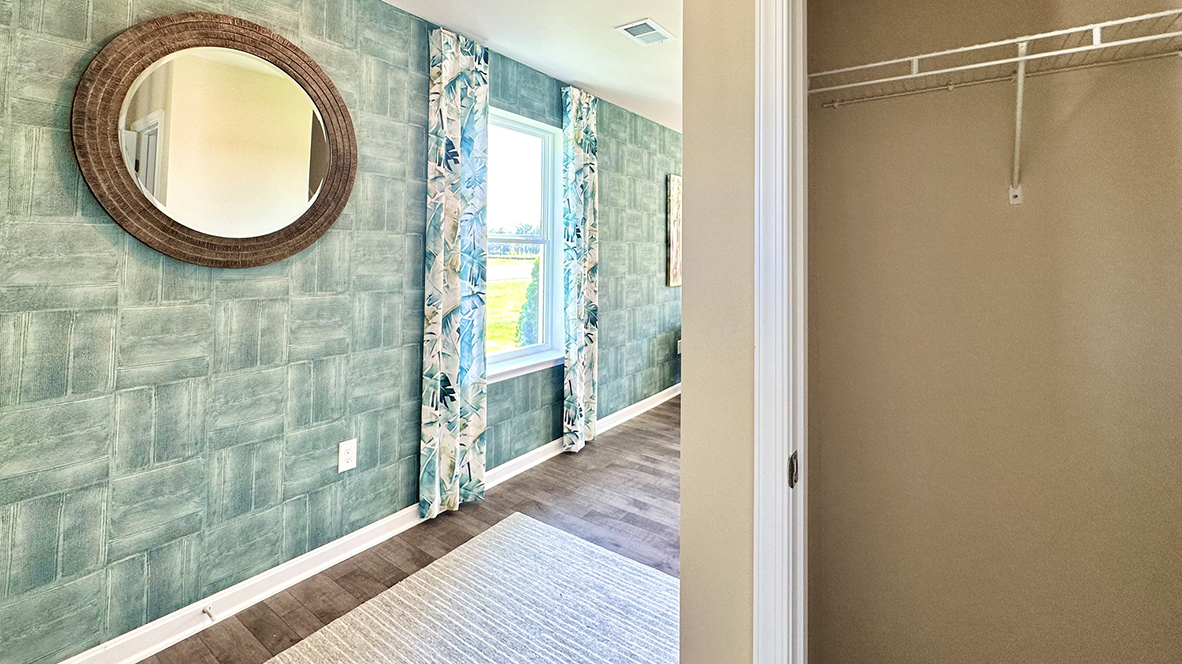 A welcoming foyer with a coat closet greets you as you enter this two-story home.