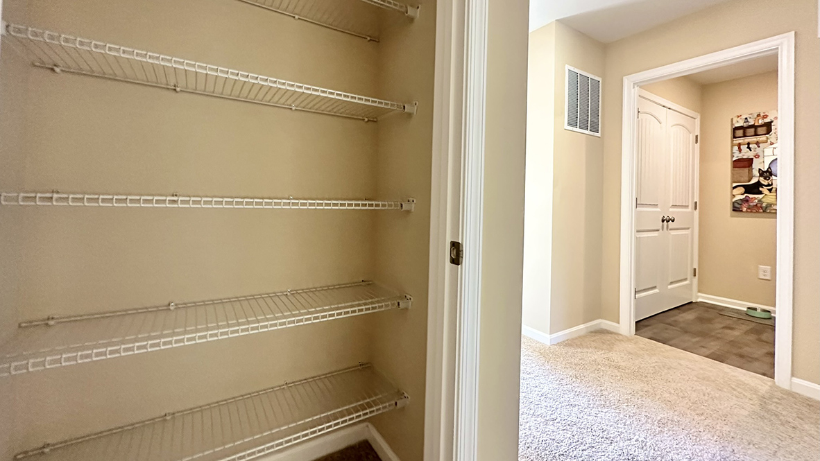 The hallway linen closet provides plenty of storage.
