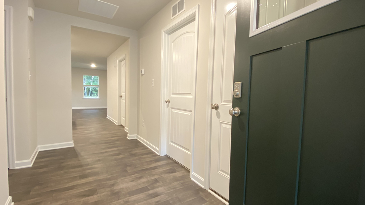 You are welcomed into the home stepping into the wide foyer.