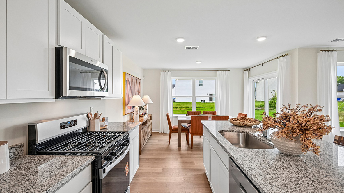 The welcoming kitchen comes with stainless-steel appliances.