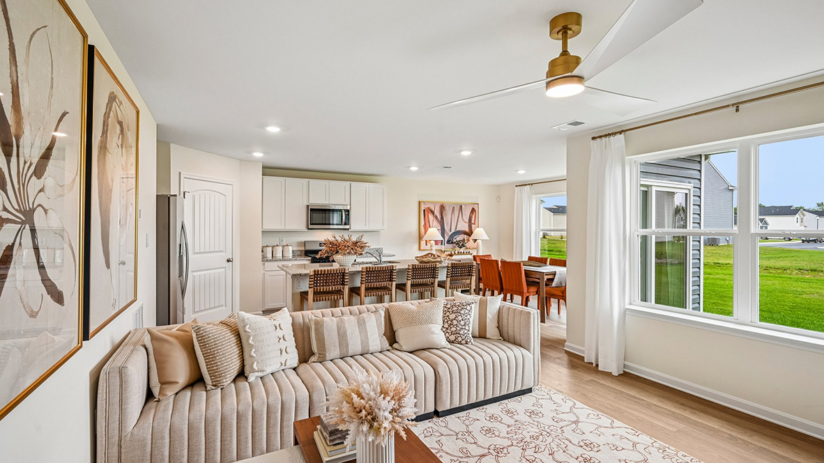 Past the foyer is the large, open concept living room that flows nicely into the eat-in kitchen.