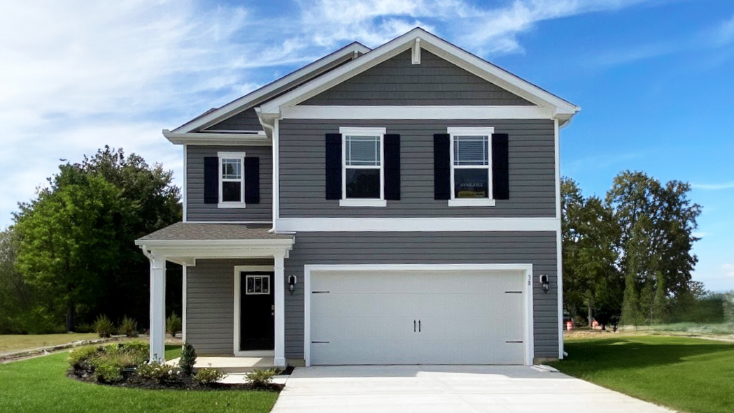 A two-story Cabral home with gray siding and black shutters.