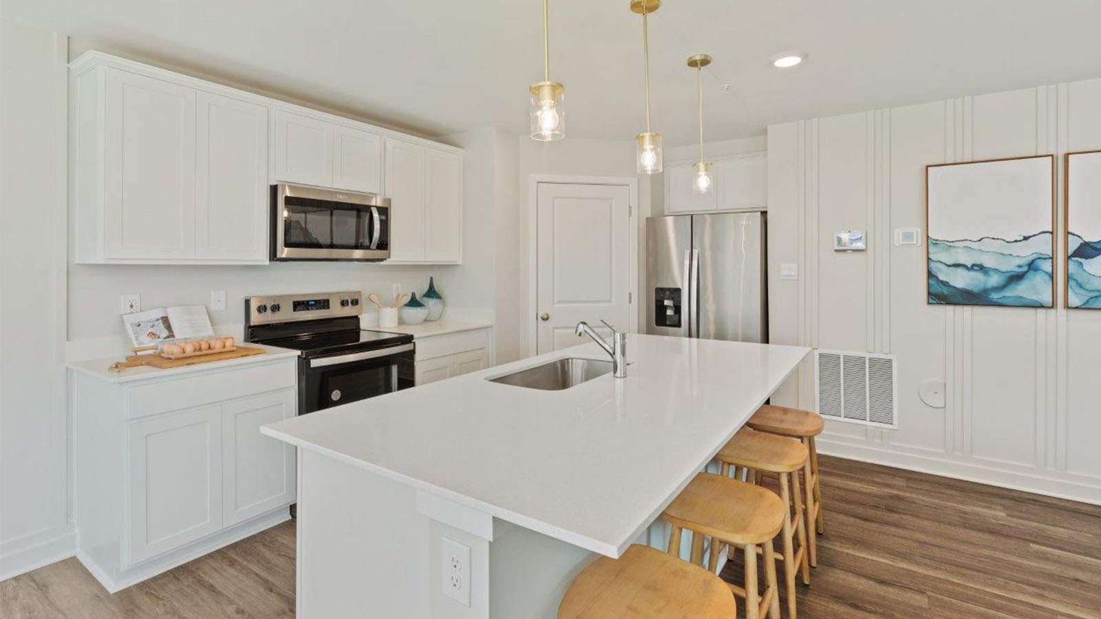 The welcoming kitchen comes with an island with enough room for seating.