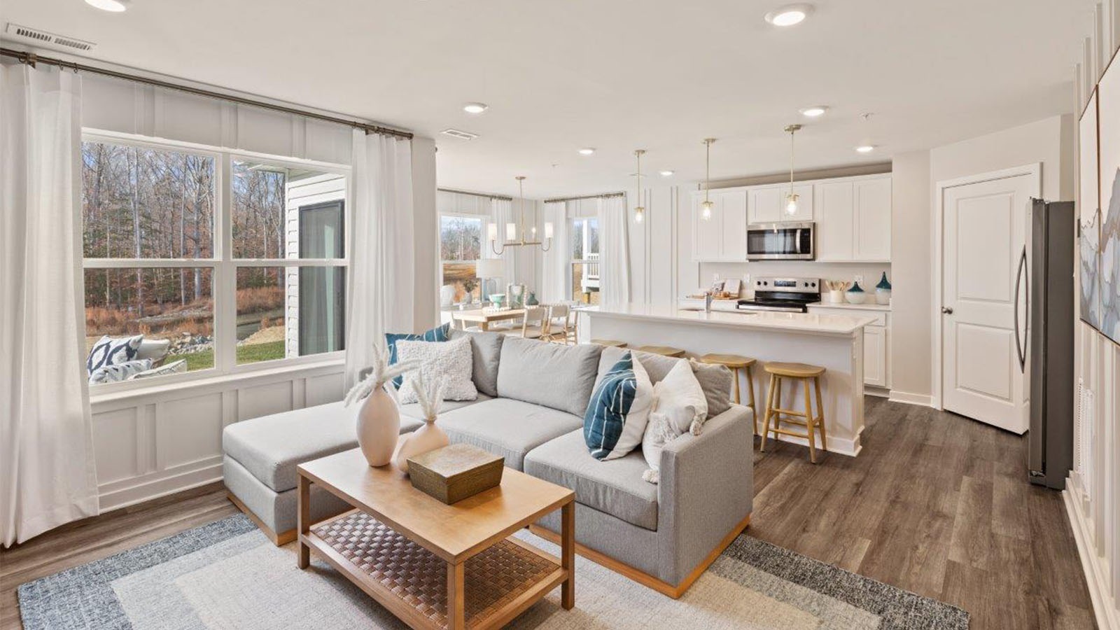 Past the foyer is the large, open concept living room that flows nicely into the eat-in kitchen