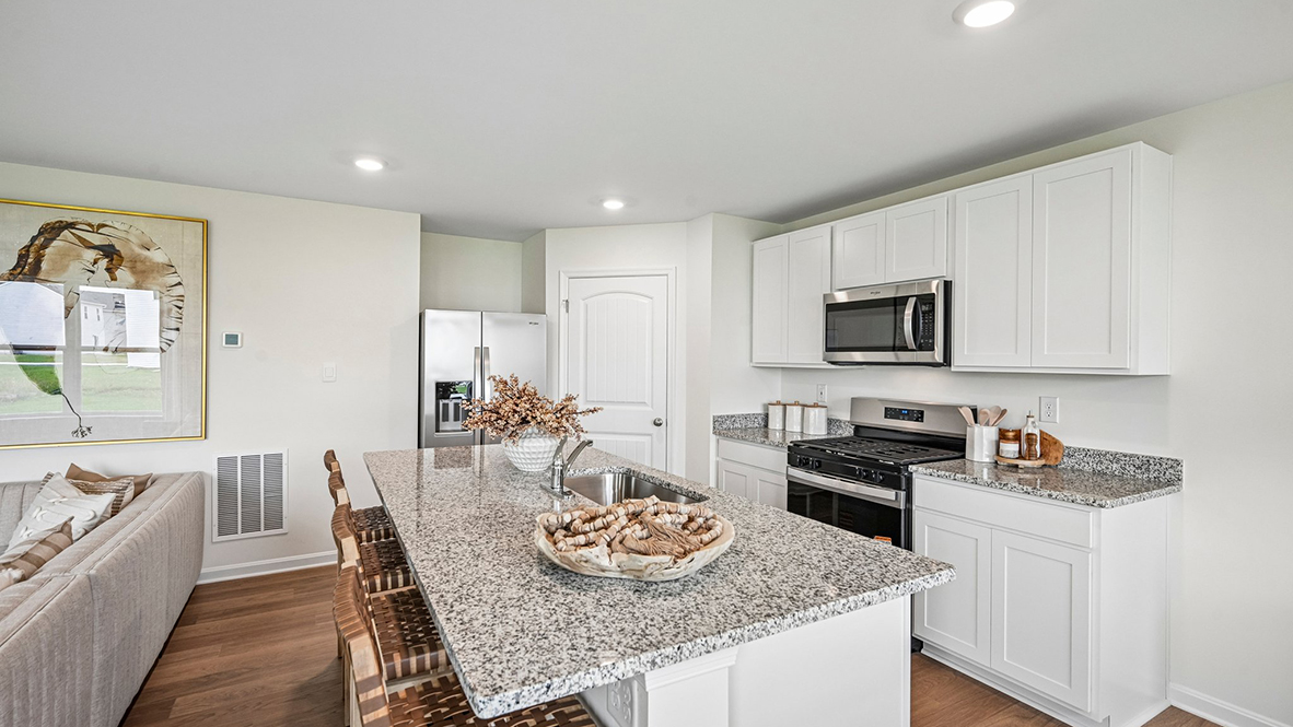 The welcoming kitchen comes with tasteful cabinetry.