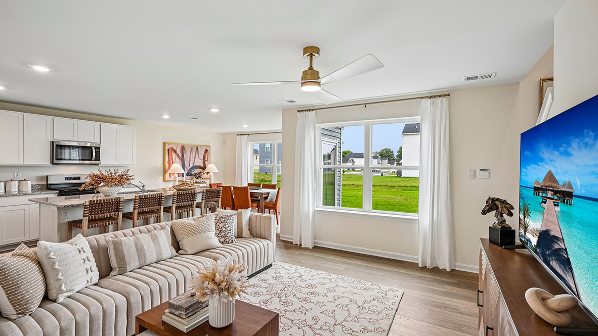 Past the foyer is the large, open concept living room that flows nicely into the eat-in kitchen.
