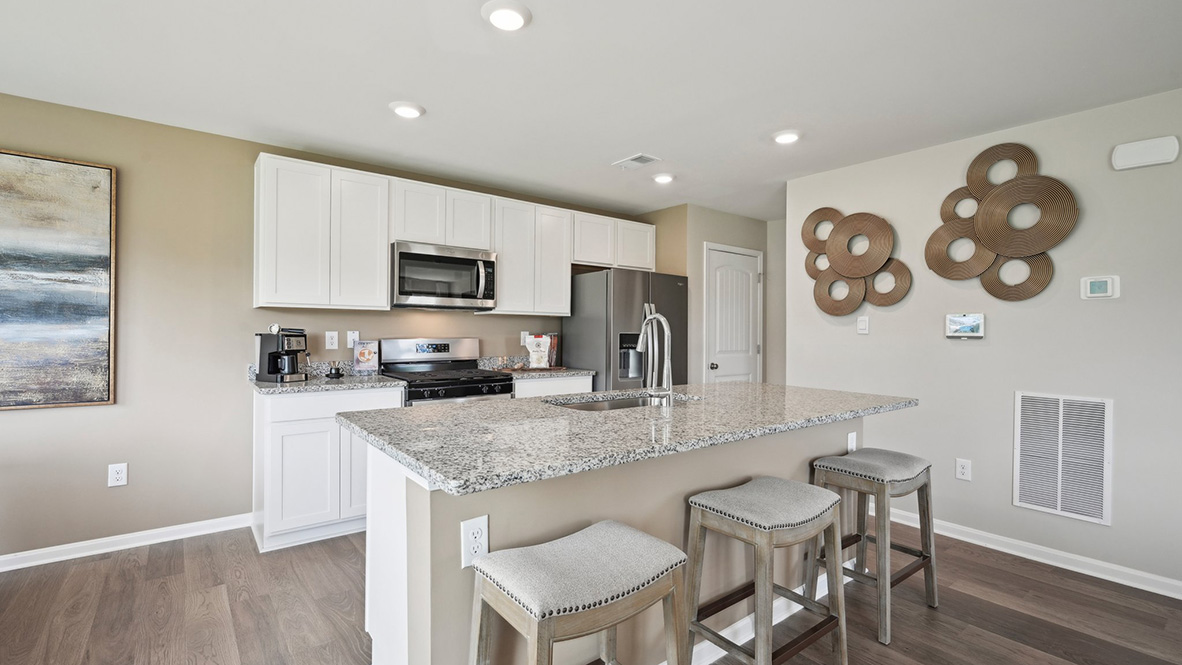 The spacious kitchen has a large island with room for seating.