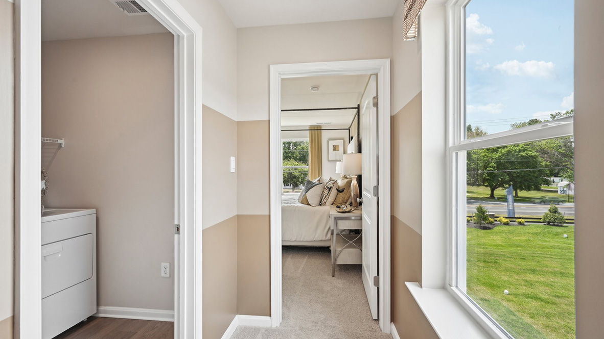 The laundry room is located by the stairs.