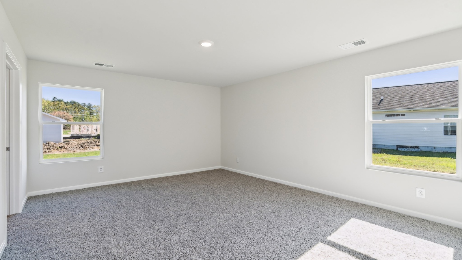 The large main bedroom is a retreat in the back of the home.