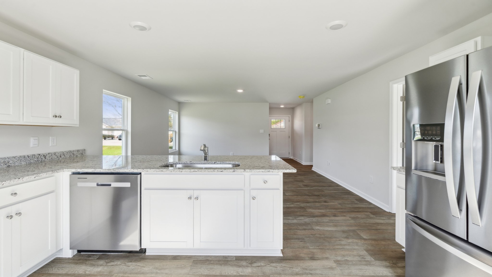 The well-equipped kitchen is complete stainless steel appliances.