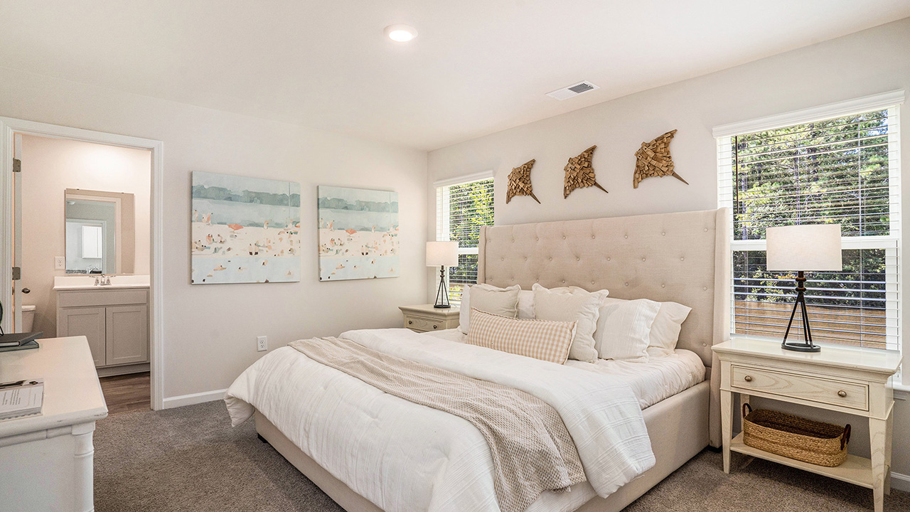 The main bedroom is set apart in the back of the home and features a walk-in closet and full bathroom.
