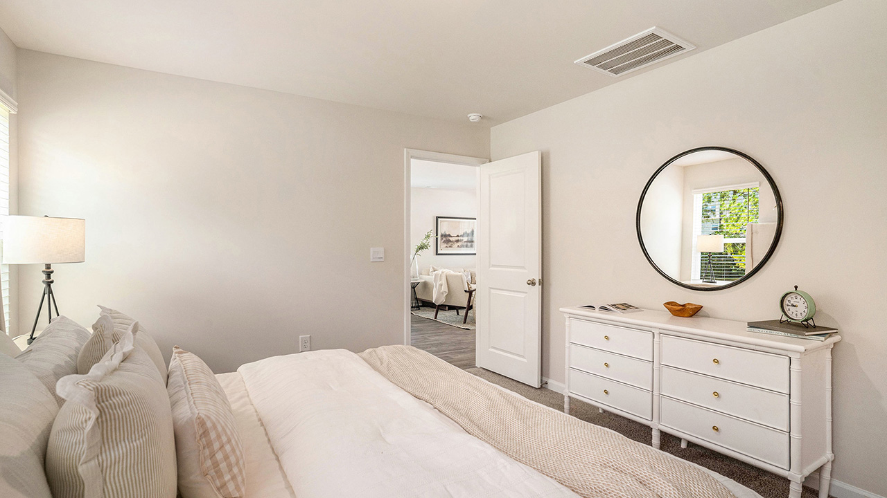 The main bedroom is set apart in the back of the home.