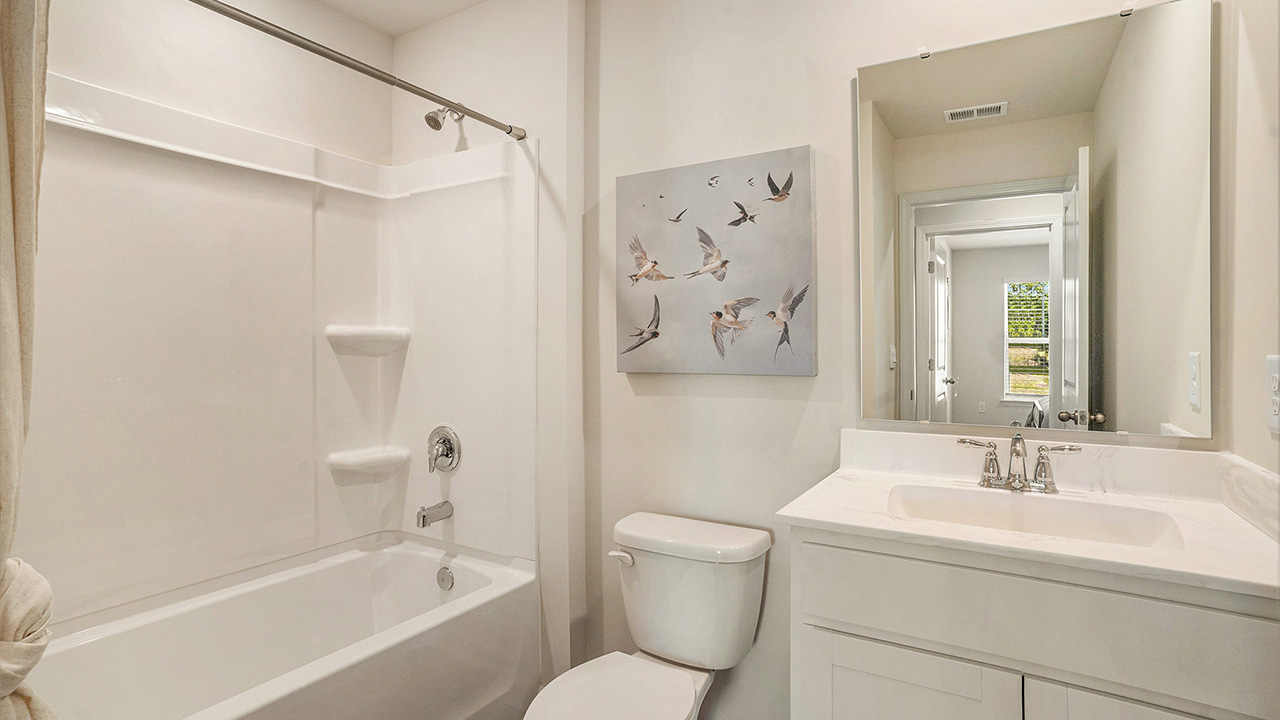 The two guest bedrooms and guest bathroom are separate from the living areas of the home.