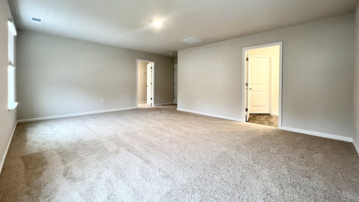 Upstairs, you will enter the inviting loft which also has a linen closet, a door to the owner's suite.