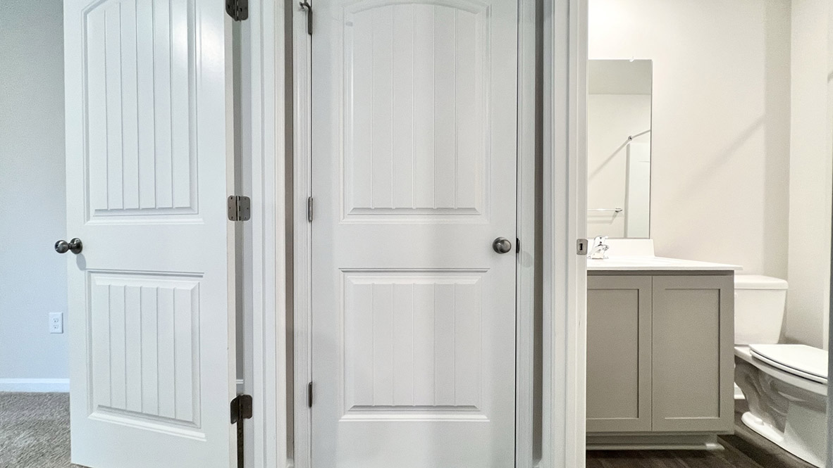 Adjacent to the downstairs bedroom is a full bathroom.