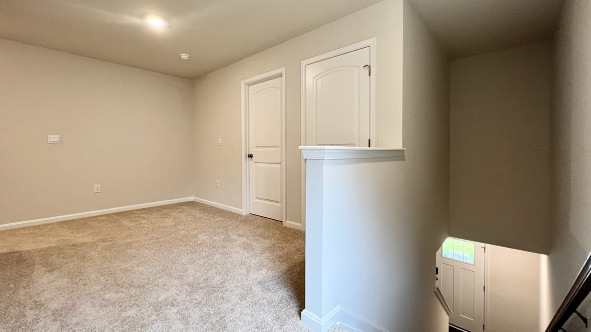 Upstairs, you will enter the inviting loft.