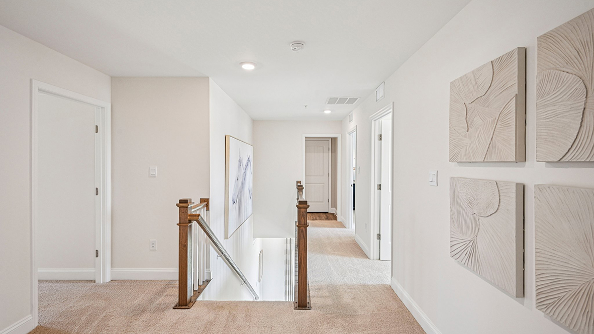 As you make your way up the stairs that are nestled in the corner of the great room you will find a vast landing.