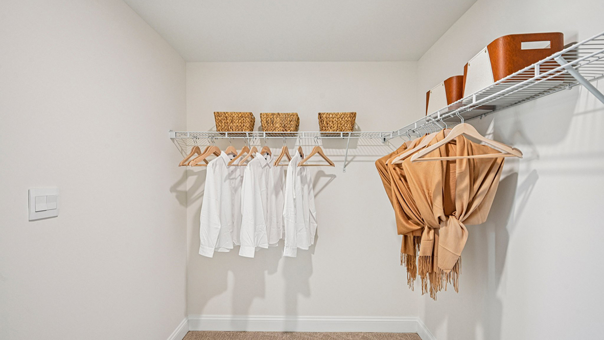 The impressive owner’s suite boasts an expansive bedroom with a huge walk-in closet.