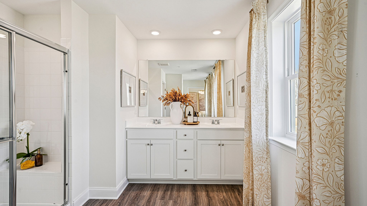 The impressive owner’s suite boasts an expansive bedroom and a contemporary owner’s bathroom.