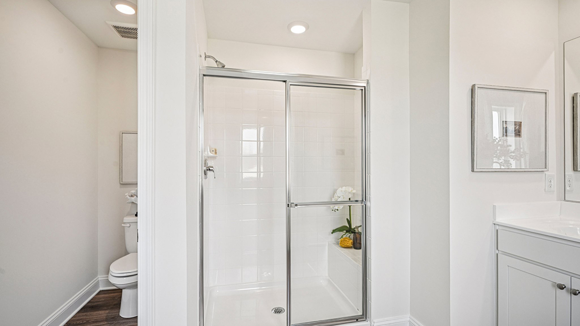 The impressive owner’s suite boasts an expansive bedroom and a contemporary owner’s bathroom.