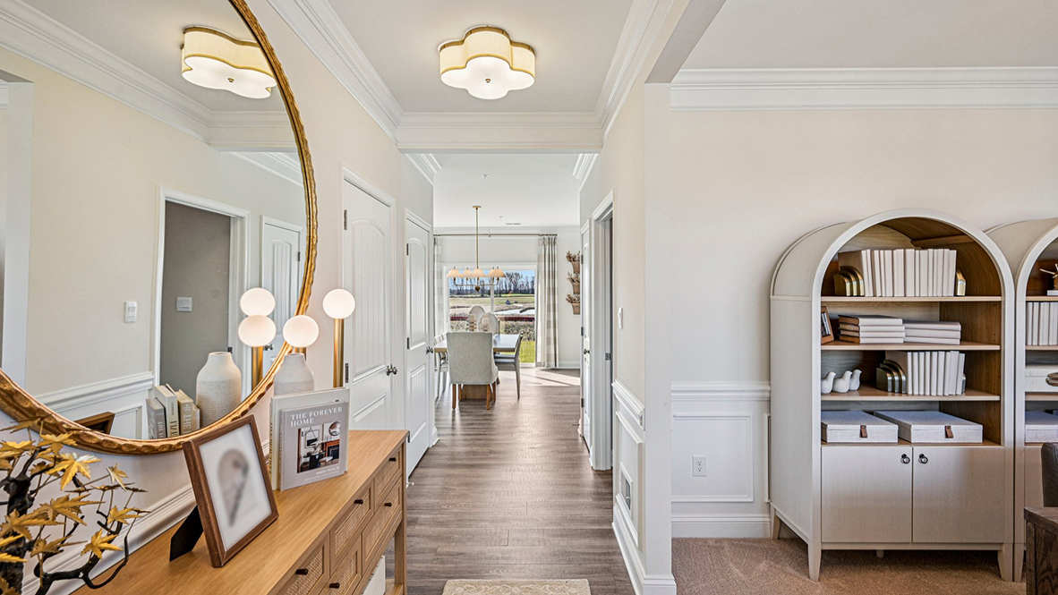 This well-designed home has an inviting foyer that is open to the functional flex room.